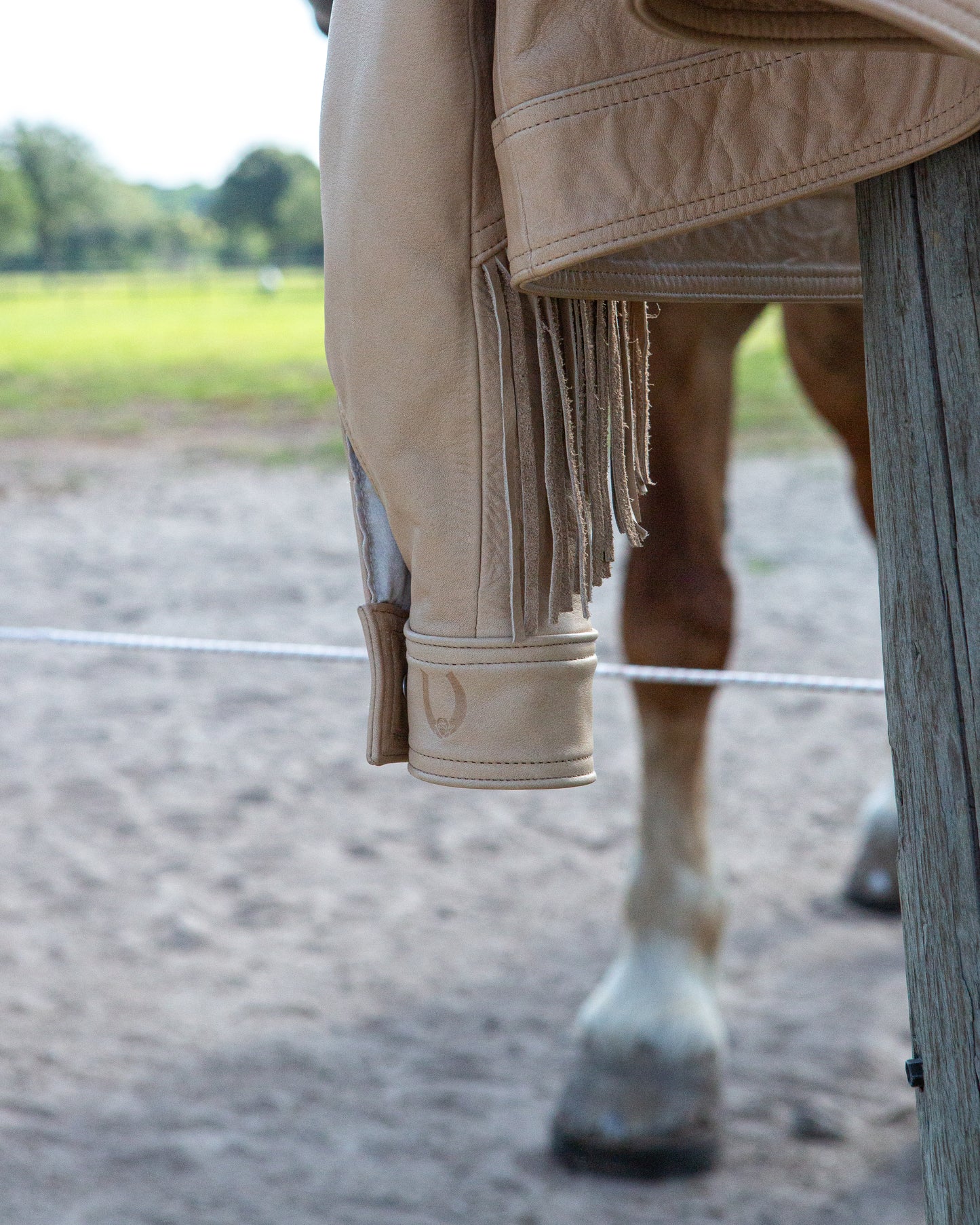 Embossed Desperado rodeo rose horseshoe logo on left cuff